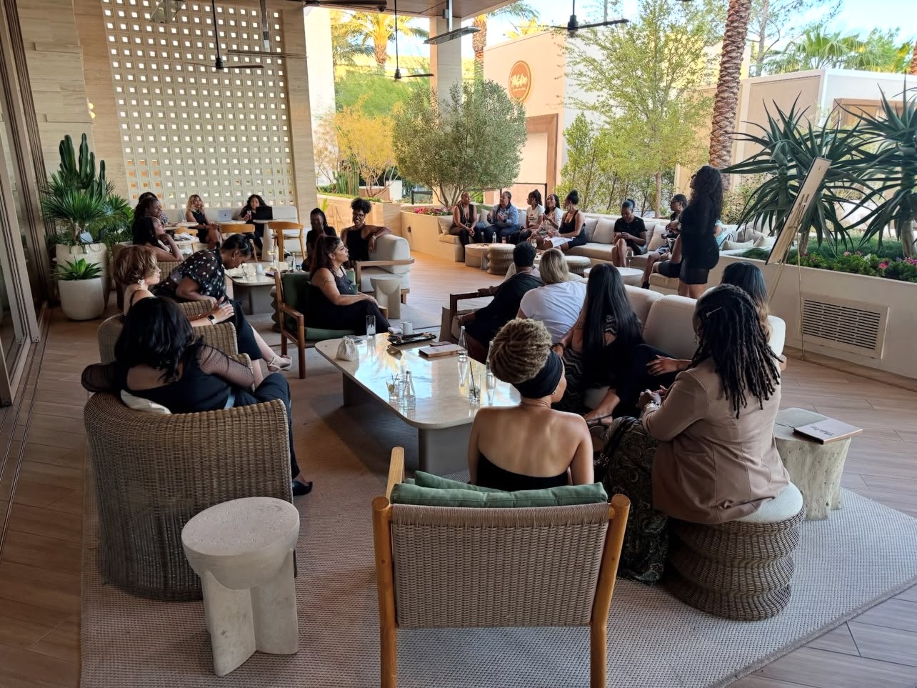 Women seated in a circle listening at a WEPN room